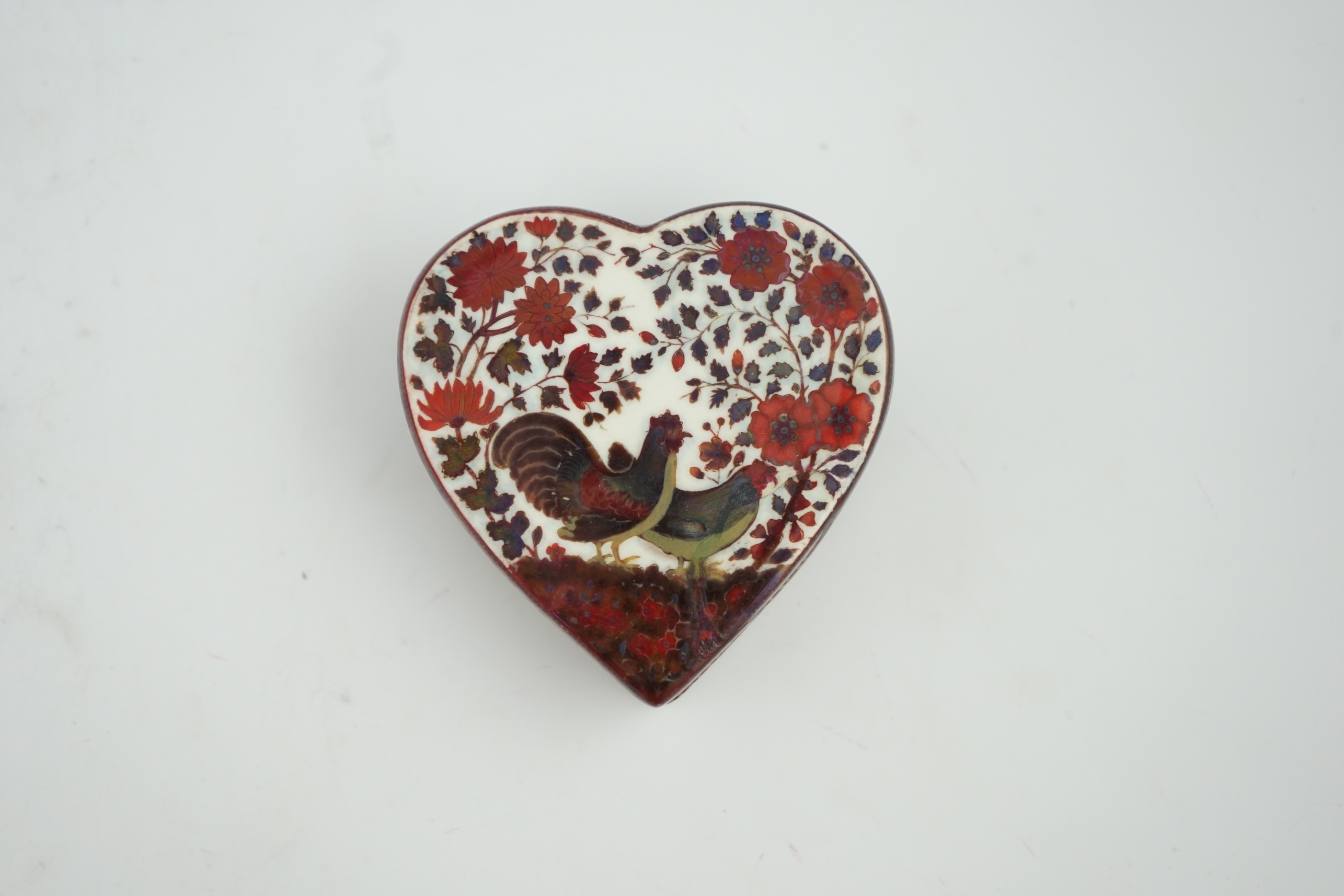 An early Zsolnay flambé lustre heart shaped box and cover, late 19th century